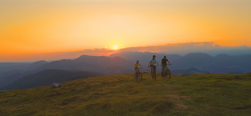 mountain bikers at sunset on a ridge trail near Winthrop WA